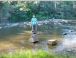 Rob collecting pebbles to carve